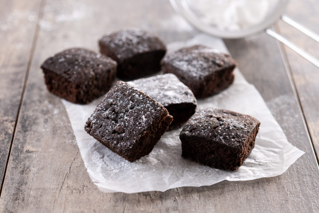 Homemade chocolate brownies on wooden table