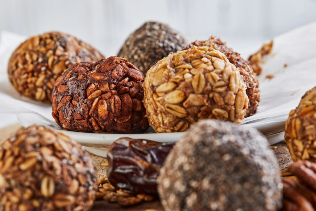 Healthy Organic Energy balls Muesli Bites with Nuts, Cocoa, Chia and Honey - Vegan Vegetarian Raw Snacks or Food. copy space.